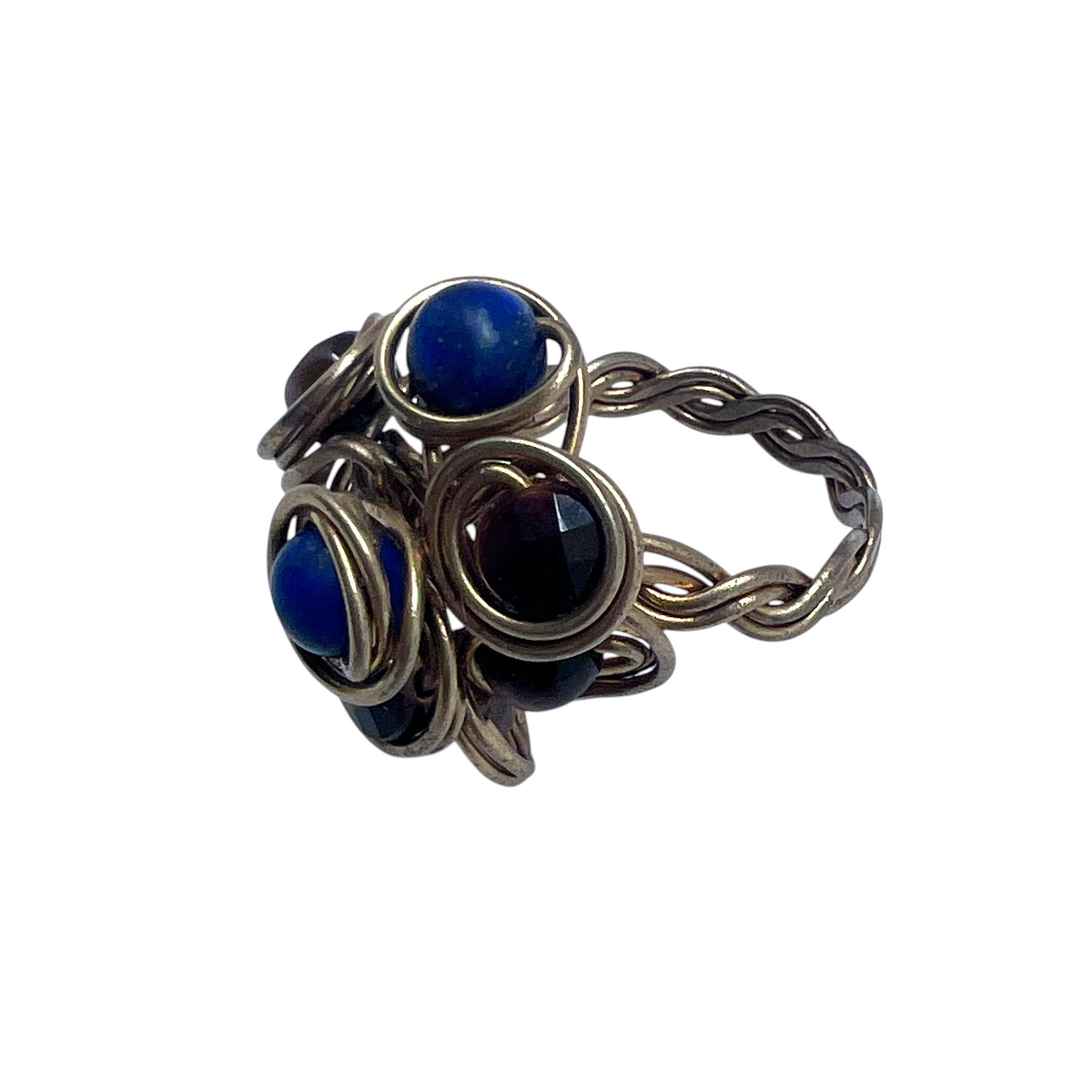 Ruby Feathers handcrafted statement ring with blue Lapis Lazuli and brown Tiger's Eye beads in braided brass wire.