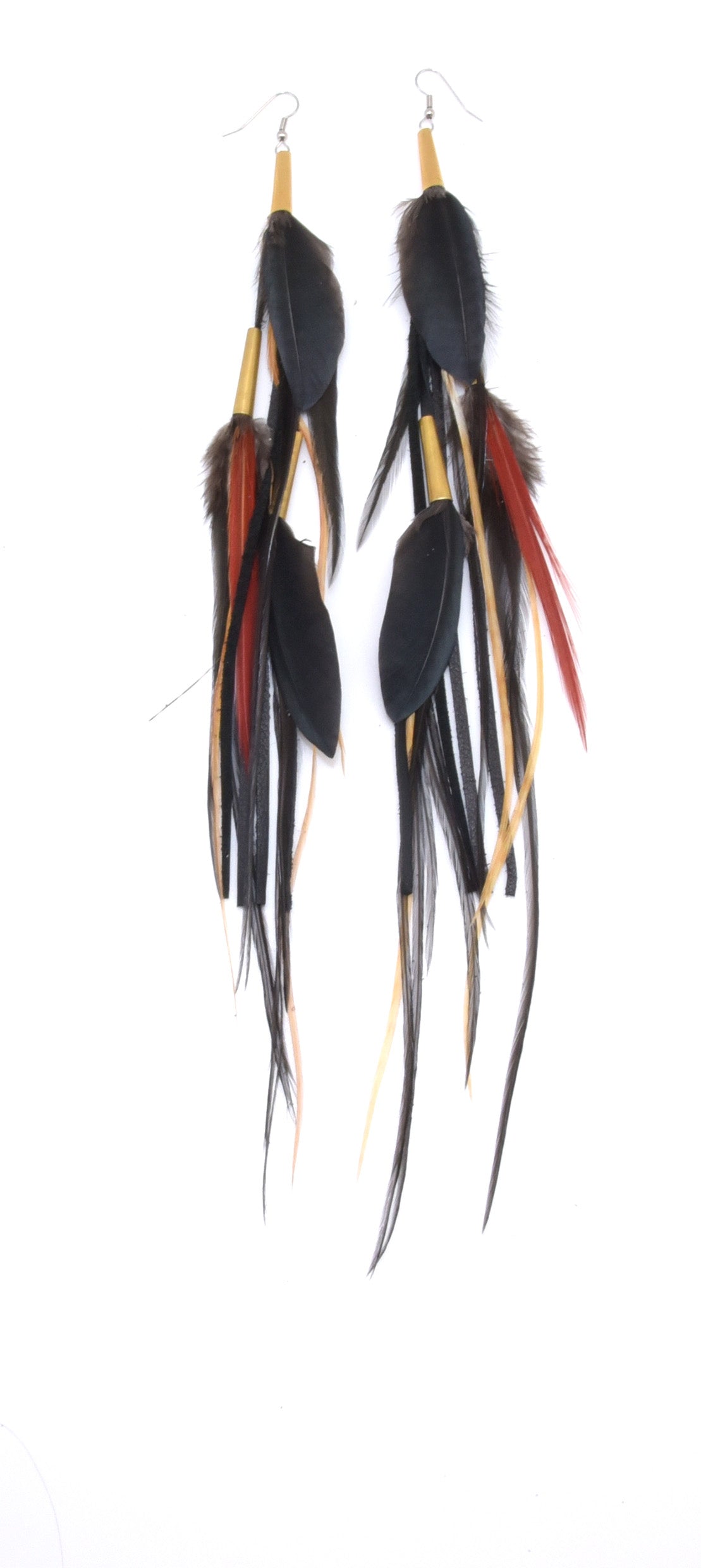 Ruby Feathers Utopia earrings featuring long, handcrafted black and red ethically sourced feathers on gold hooks.