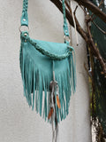 Achack leather and feather fringe bag.