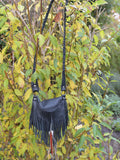 Achack leather and feather fringe bag.