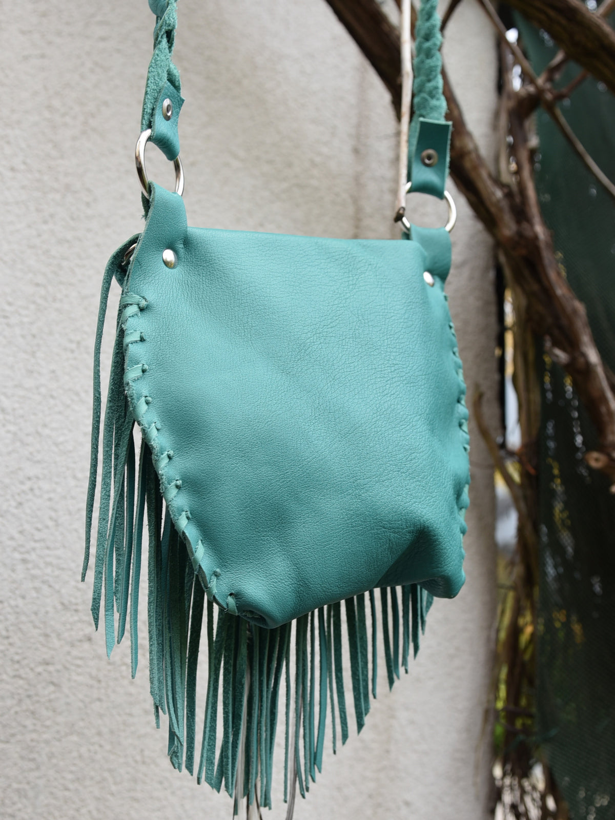 Ruby Feathers Achack leather and feather fringe bag.