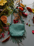 Achack leather and feather fringe bag.