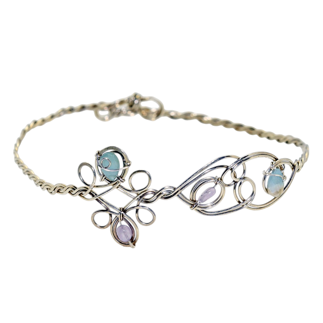 Ruby Feathers Astra Halo crown featuring amethyst and beryl stones woven into silver-covered copper wirework.