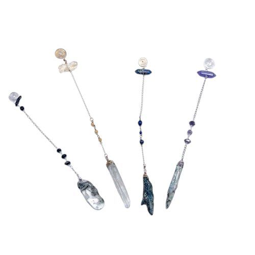 Ruby Feathers handcrafted pendulums featuring blue kyanite, amethyst, and steel elements for spiritual practice.