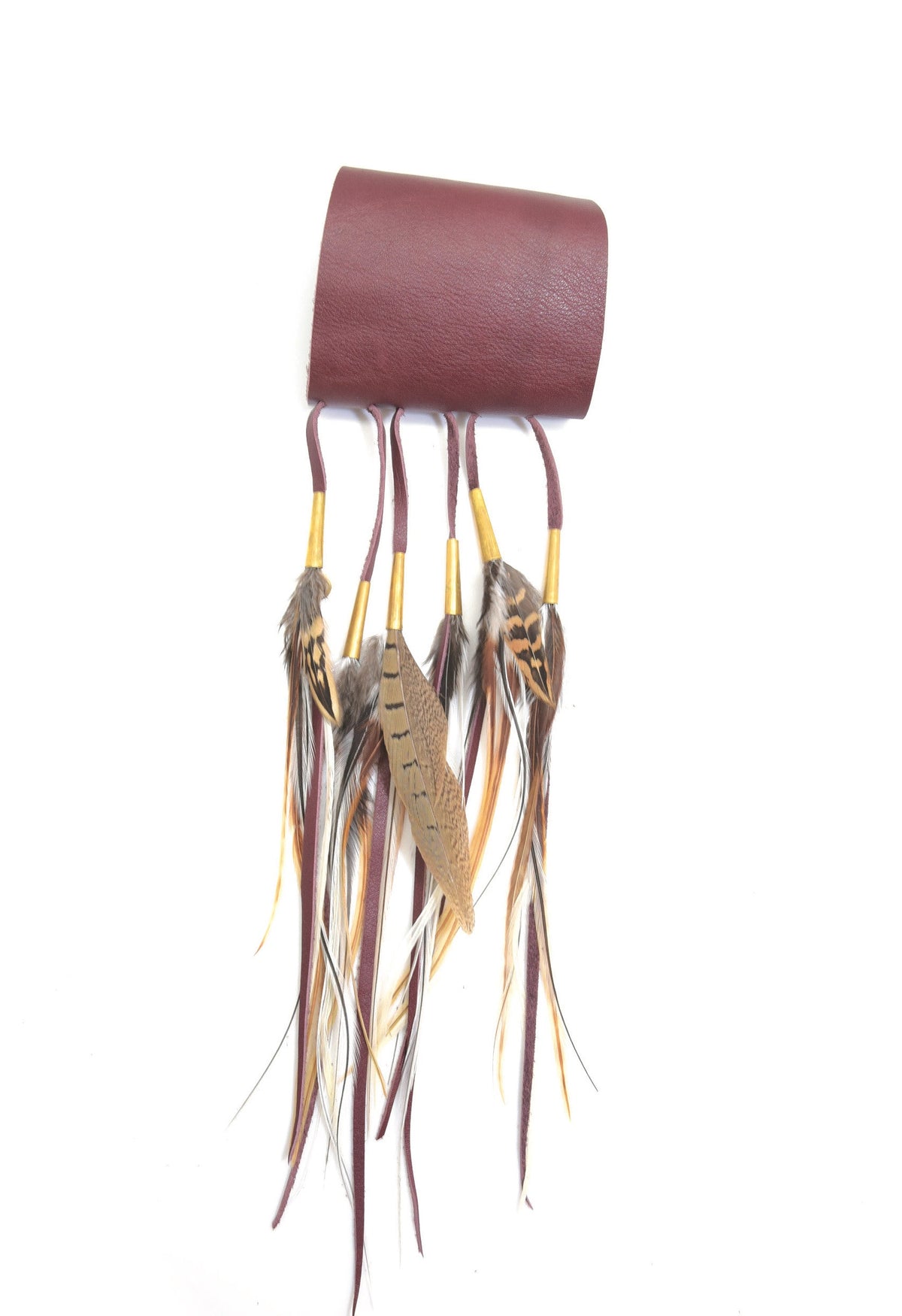 Ruby Feathers bohemian calfskin leather cuff with flowing ethically sourced feather fringe in earthy brown tones.