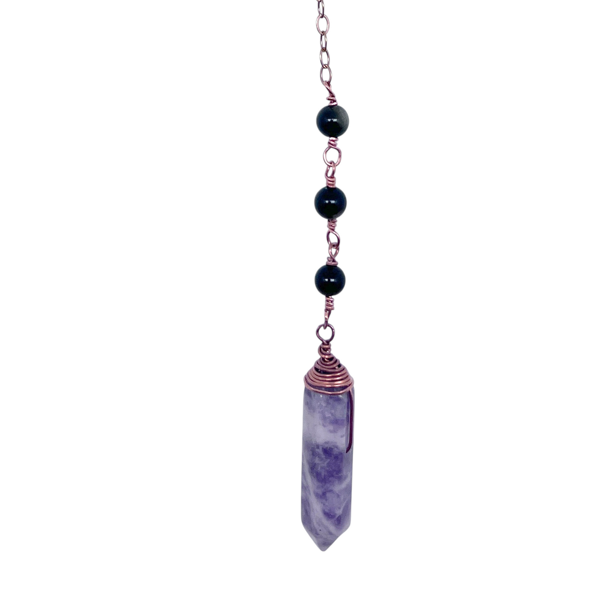 Ruby Feathers Serene Balance pendulum with a lepidolite point, black obsidian beads, and a copper wire-wrapped chain.