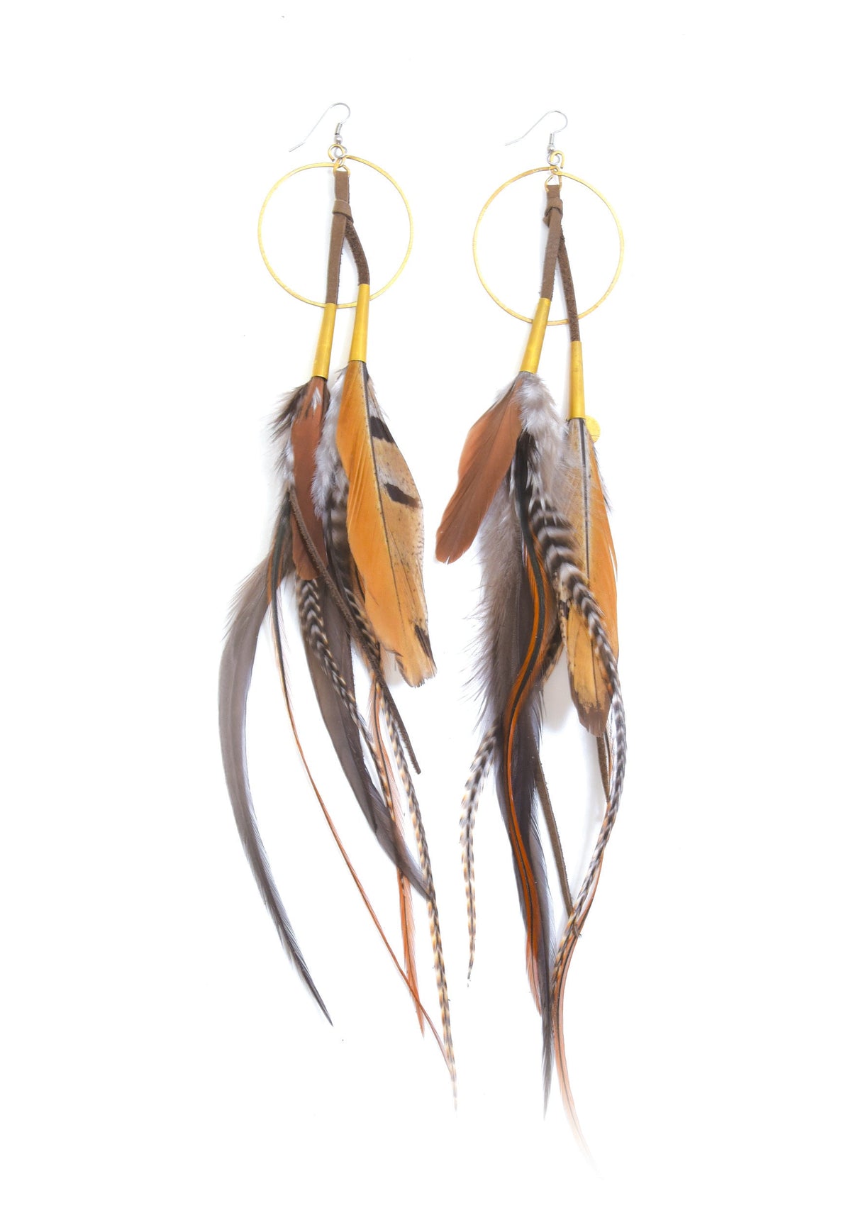 Ruby Feathers Luna hoop earrings featuring brown leather tassels and long, natural patterned feathers.