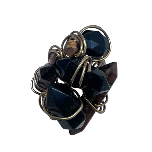 Ruby Feathers handcrafted ring featuring black obsidian and tiger's eye crystals wrapped in rustic brass wire.