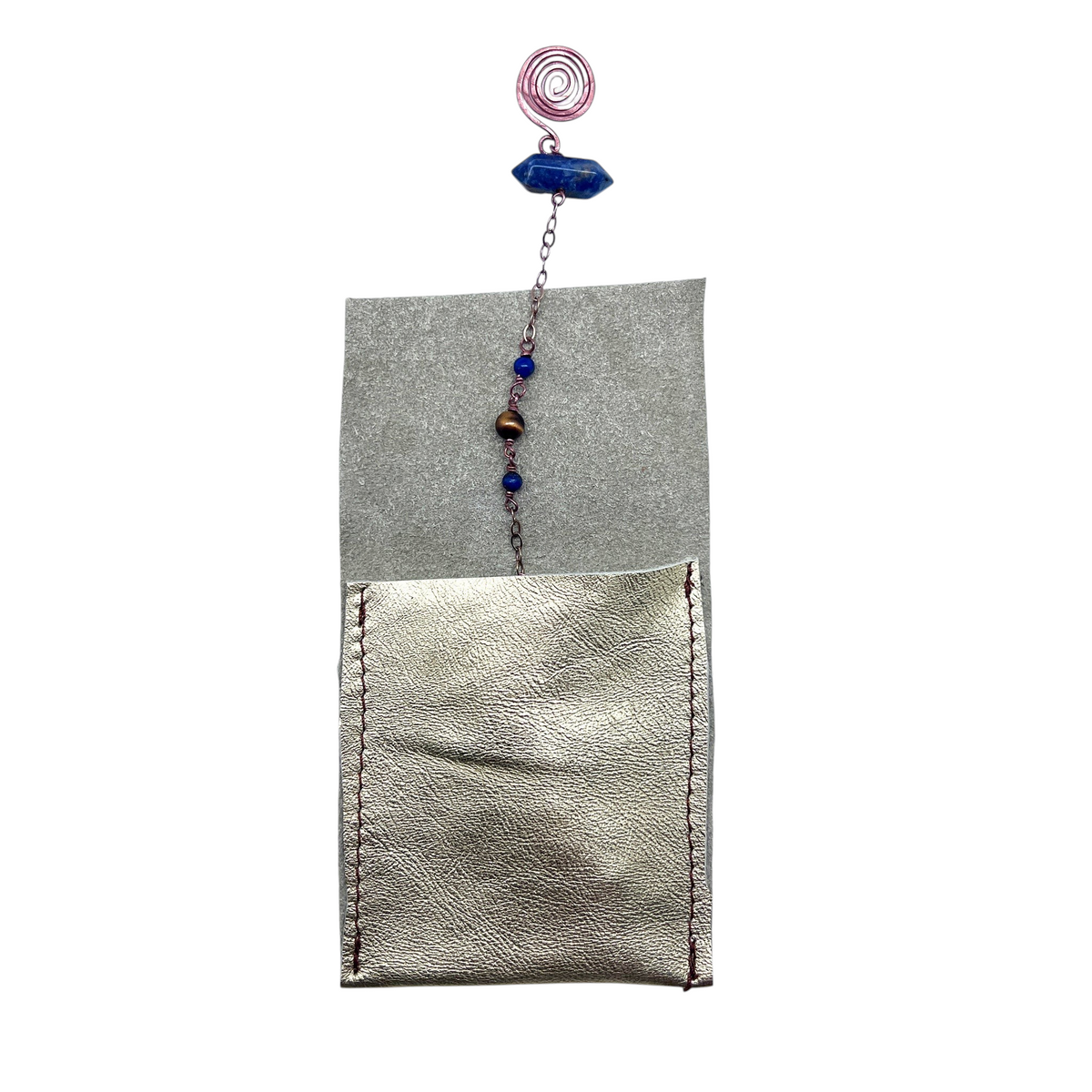 Ruby Feathers Sacred Truth pendulum with tiger's eye, lapis lazuli beads, and copper chain in a leather pouch.