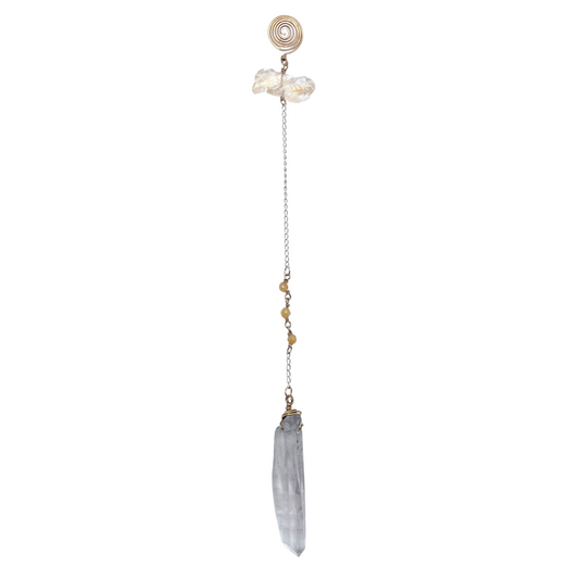 Ruby Feathers Golden Shadow pendulum featuring a raw smoky quartz point, yellow citrine, and brass chain accents.