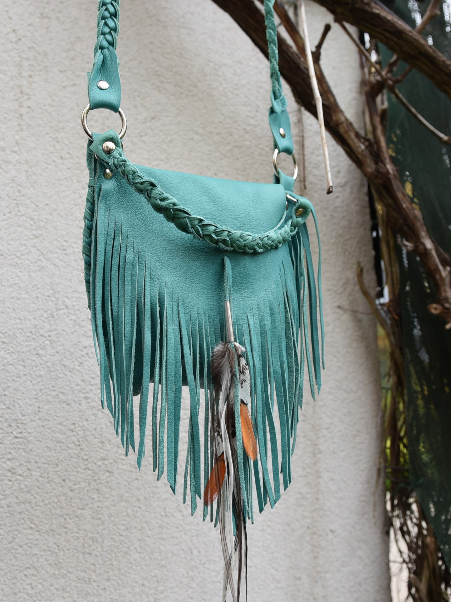 Achack leather and feather fringe bag.