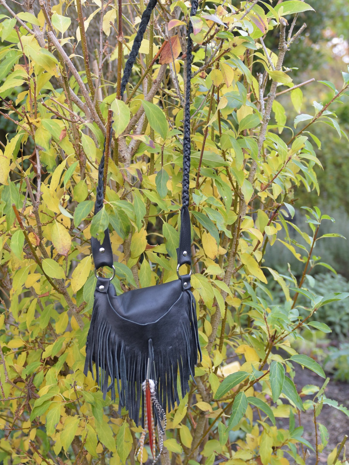 Achack leather and feather fringe bag.