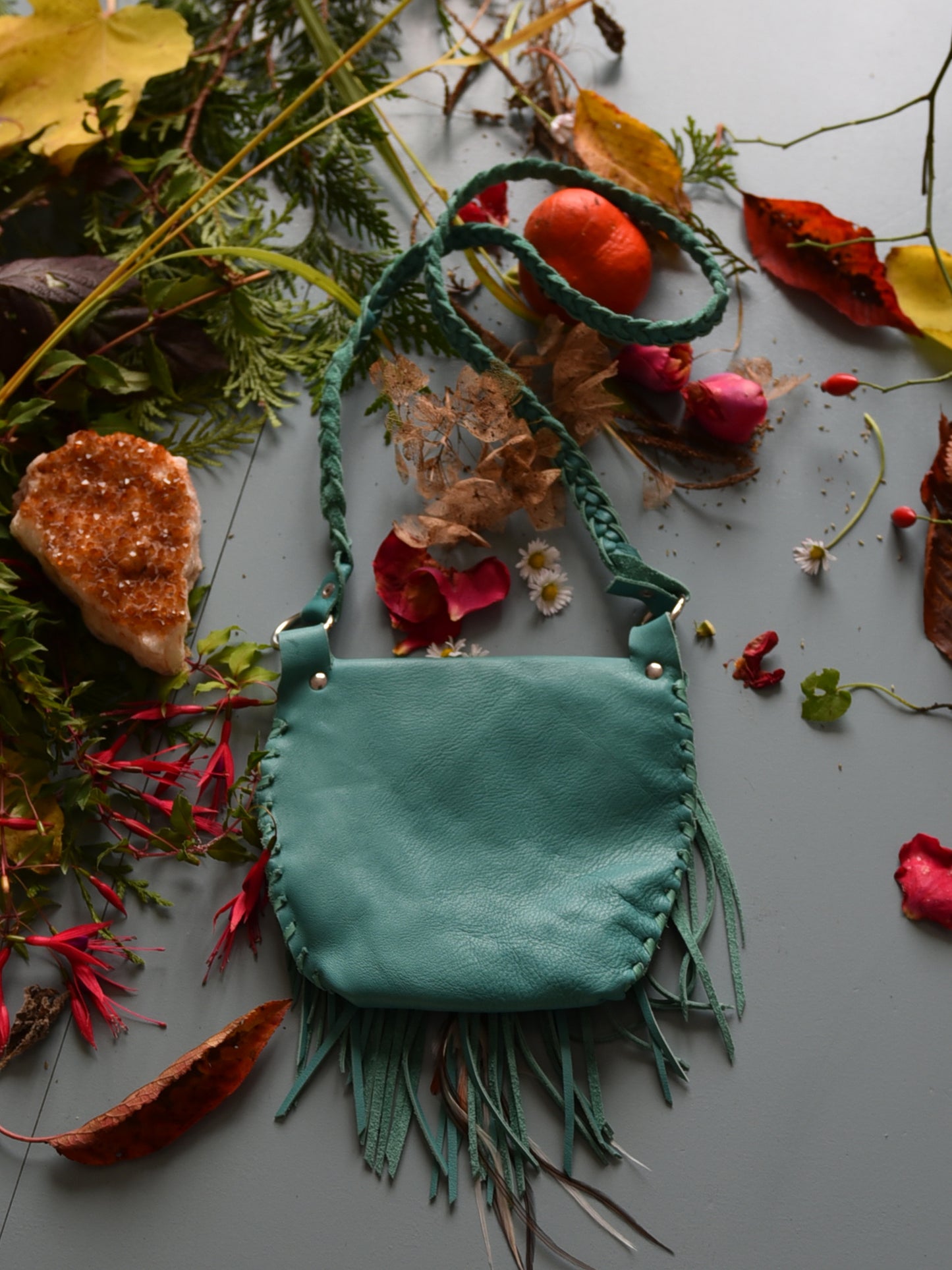 Achack leather and feather fringe bag.