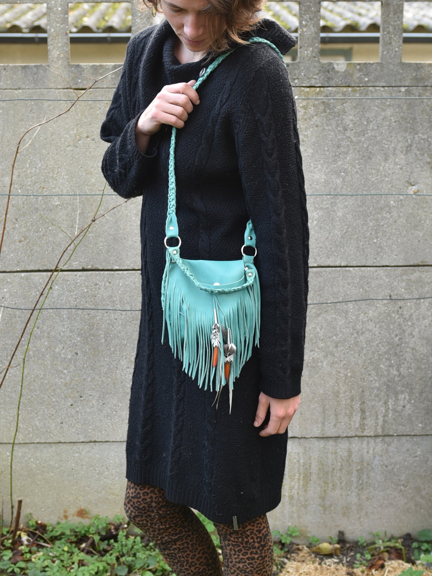 Achack leather and feather fringe bag.